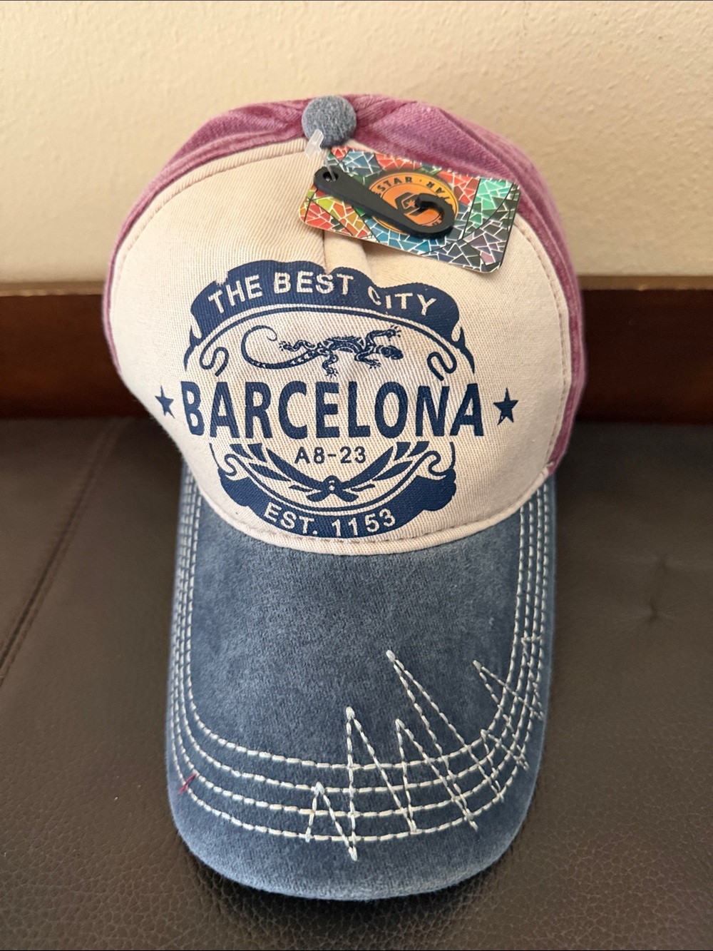 “The Best City Barcelona” Baseball Cap Features a Blue Brim with White Stitching